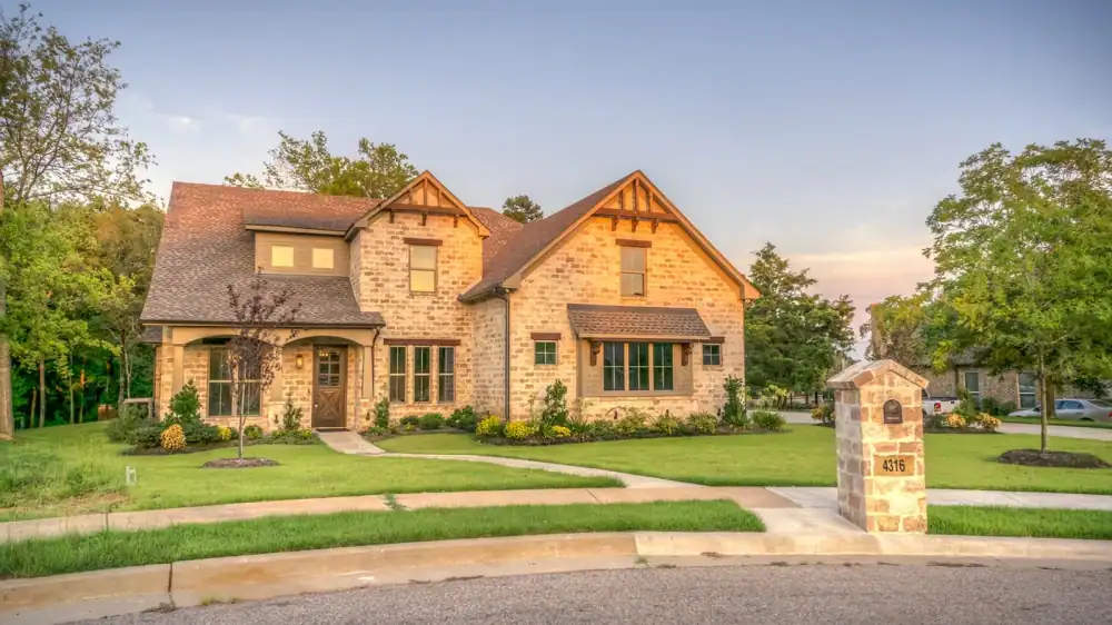 Two-story residential home with a landscaped front yard